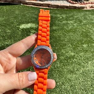 Geneva ladies Orange rubber band watch jeweled bezel